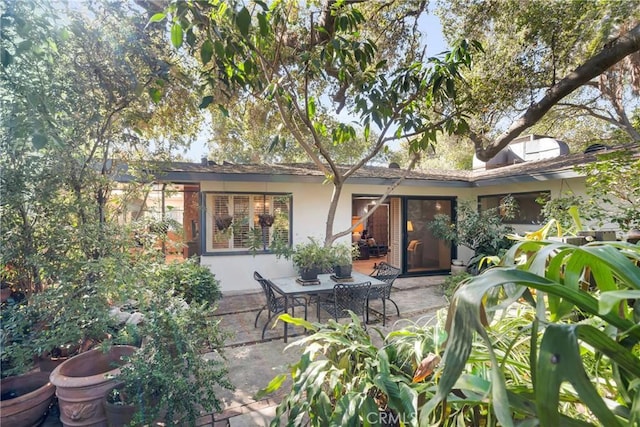 rear view of property featuring a patio