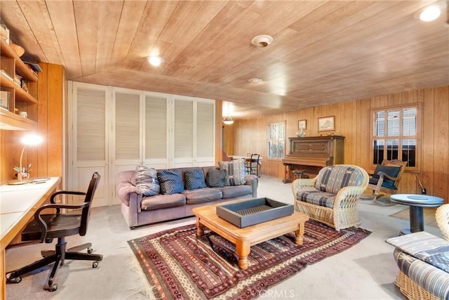 living room with wooden ceiling, light carpet, and wooden walls