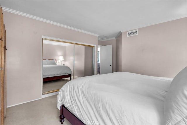 bedroom with carpet, a closet, and crown molding