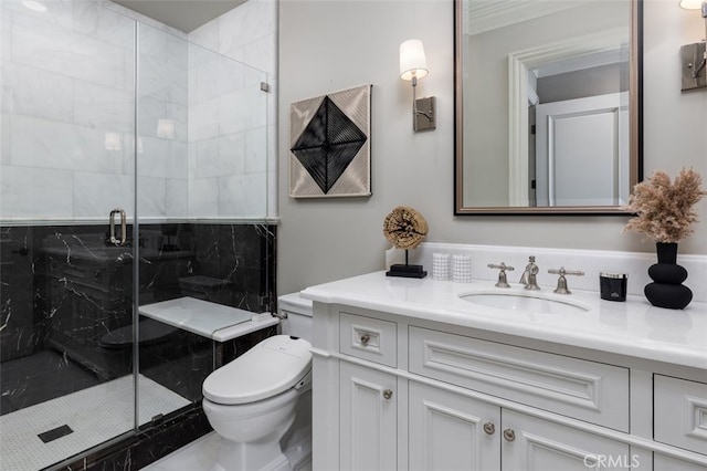 bathroom with vanity, an enclosed shower, and toilet