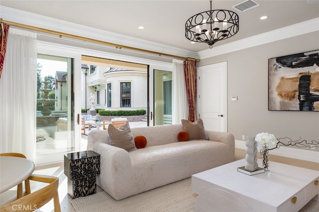 living room with crown molding and an inviting chandelier