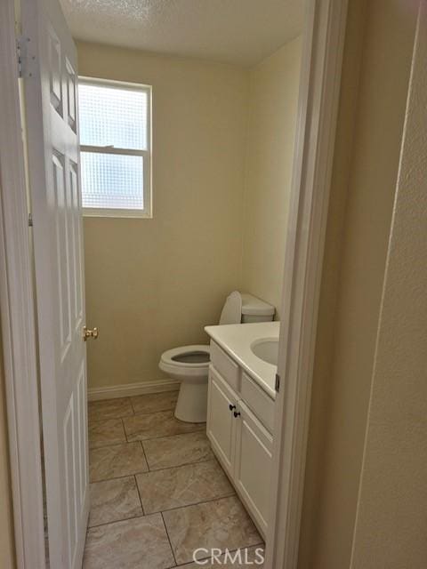 1467 Avila Dr, Perris, CA 92517 - bathroom featuring vanity and a textured ceiling