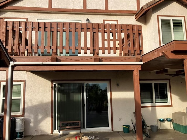 rear view of house featuring a balcony