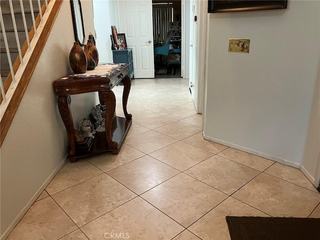 hallway featuring light tile patterned floors