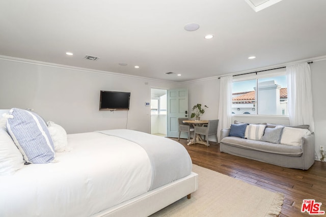 bedroom featuring ornamental molding and dark wood-type flooring