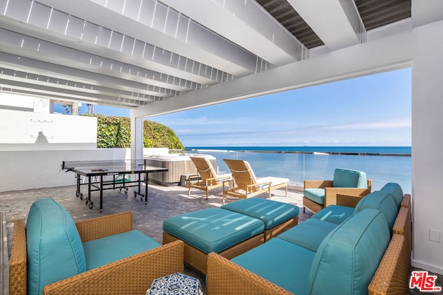 view of patio / terrace with outdoor lounge area and a water view