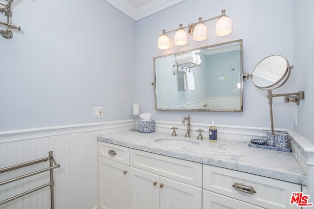 bathroom with vanity and ornamental molding