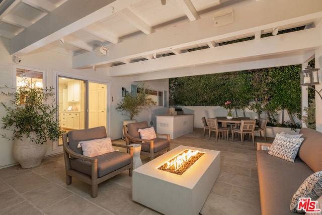 view of patio with an outdoor fire pit