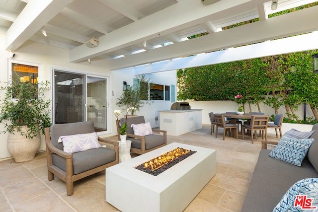 view of patio featuring an outdoor fire pit