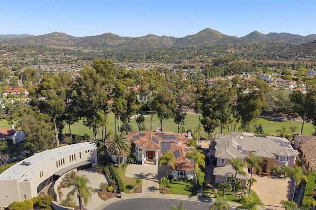 birds eye view of property with a mountain view