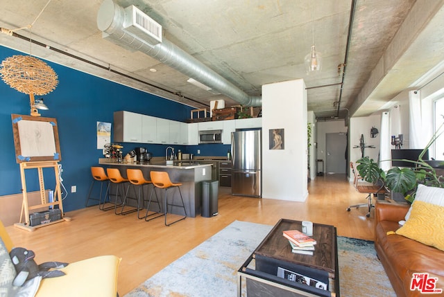 living room with light hardwood / wood-style flooring