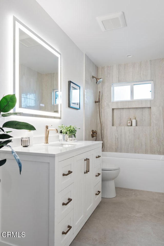 full bathroom featuring vanity, toilet, and tiled shower / bath combo