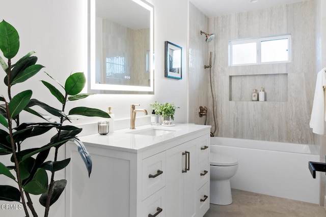 full bathroom featuring vanity, toilet, and tiled shower / bath combo