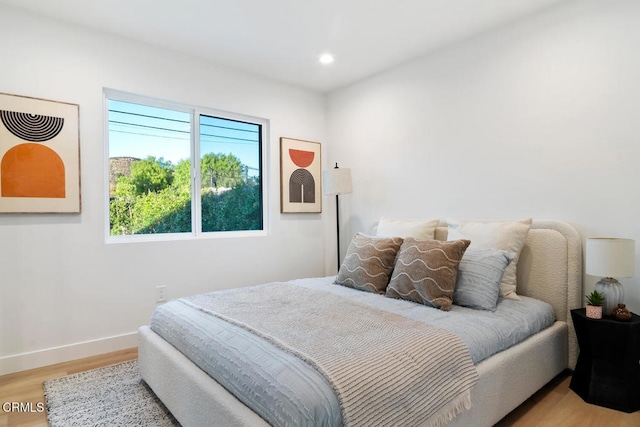 bedroom with light wood-type flooring