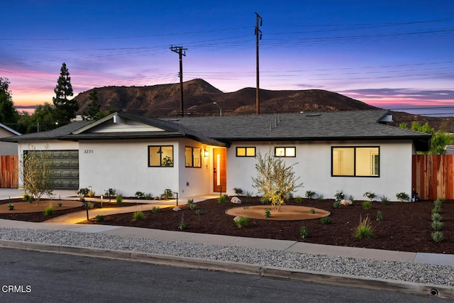 view of front of property featuring a mountain view and a garage