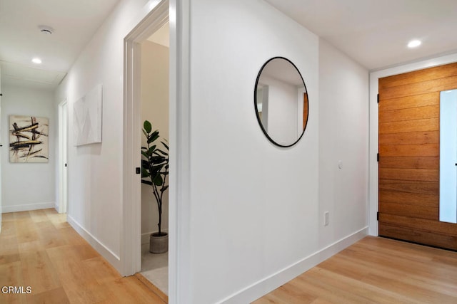 corridor featuring light hardwood / wood-style flooring