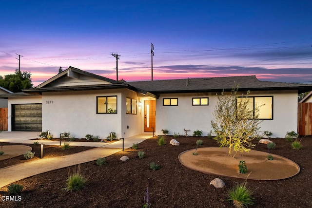 view of front of property with a garage