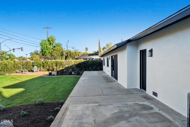 view of yard with a patio area