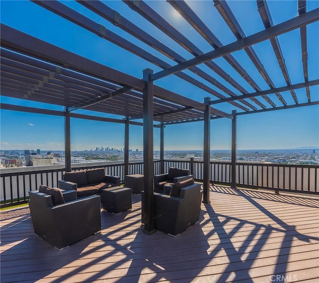 wooden deck with outdoor lounge area and a pergola