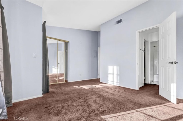 empty room featuring dark colored carpet