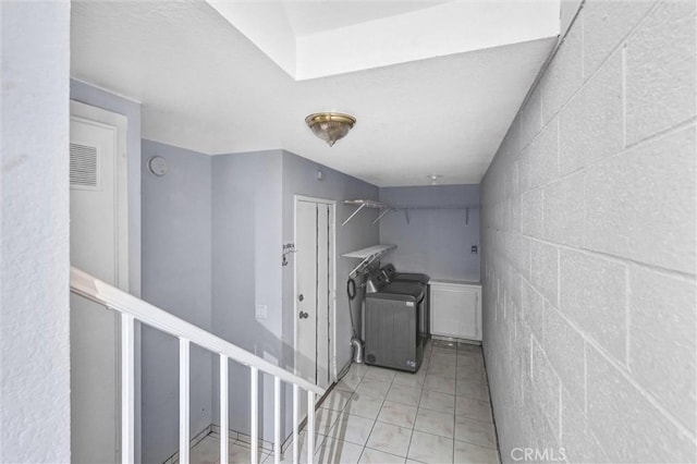 clothes washing area with separate washer and dryer