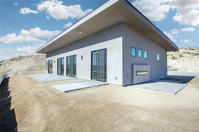 rear view of house with a patio