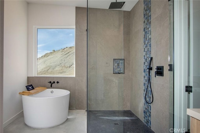 bathroom with separate shower and tub and concrete flooring