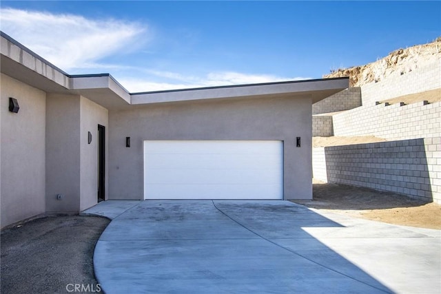 view of side of property featuring a garage