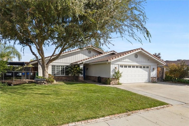 view of front facade with a front yard and a garage