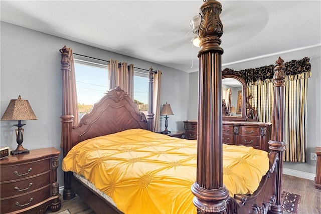 bedroom featuring ceiling fan and hardwood / wood-style flooring