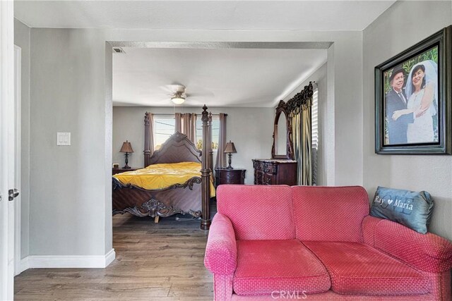 bedroom featuring ceiling fan and hardwood / wood-style flooring