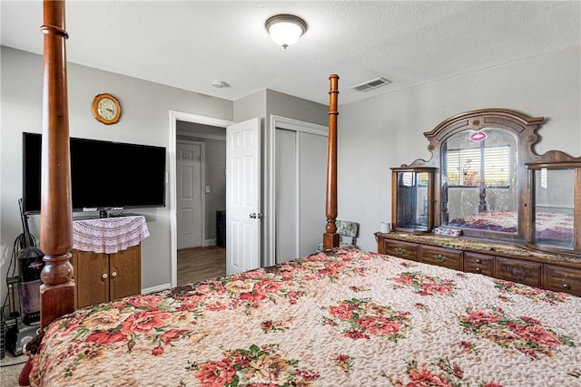 bedroom featuring a closet and hardwood / wood-style flooring
