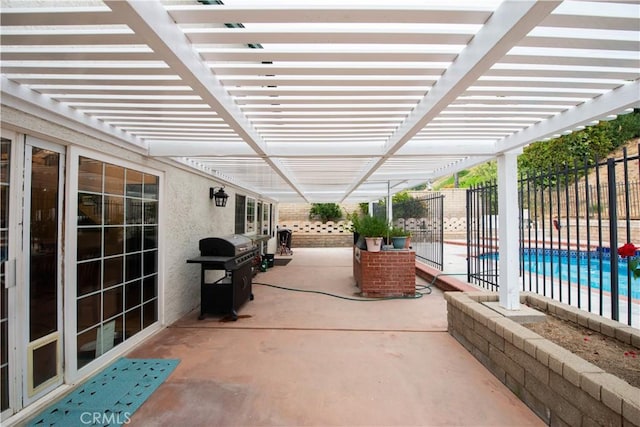 view of patio with a pergola and a grill