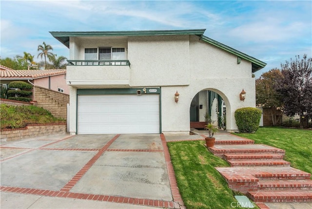 view of front of property with a garage, a balcony, and a front lawn