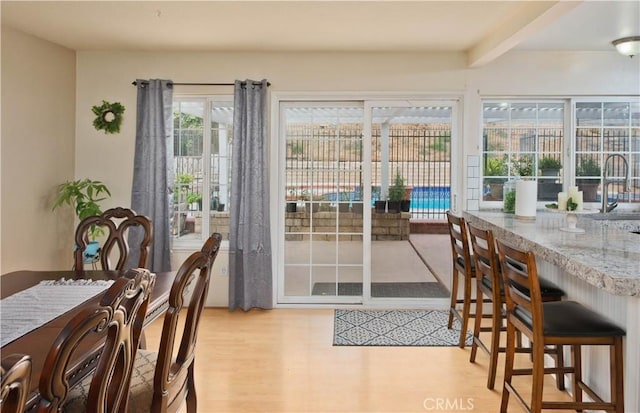 dining space with light wood-type flooring