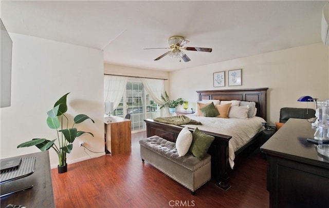 bedroom with ceiling fan and dark hardwood / wood-style flooring