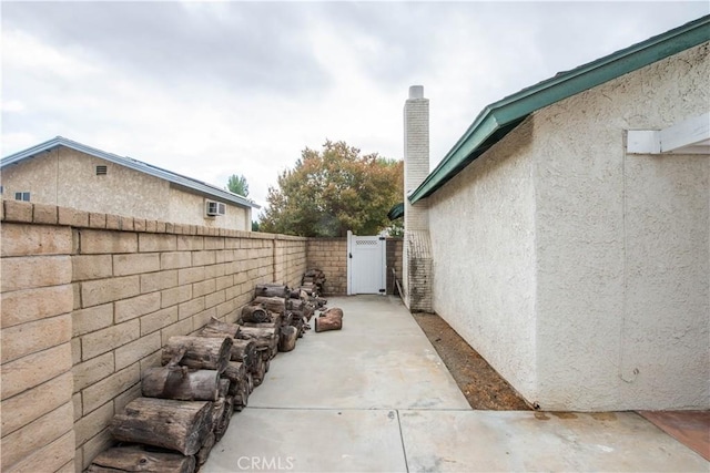 view of side of property featuring a patio area