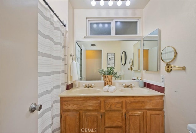 bathroom featuring vanity and walk in shower