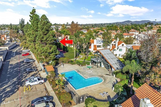 birds eye view of property with a mountain view