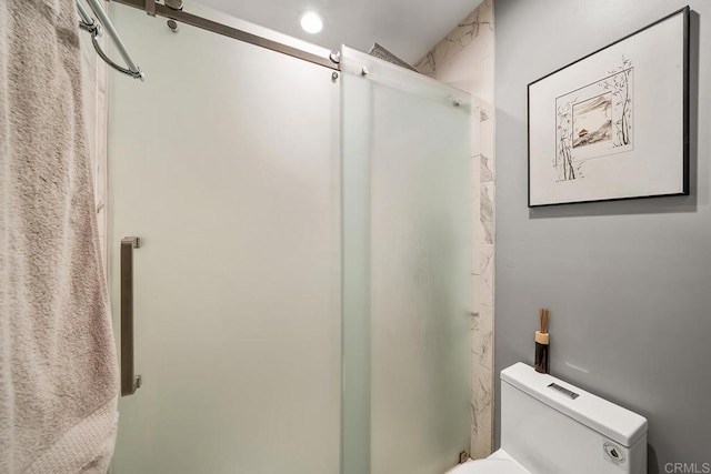 bathroom featuring an enclosed shower