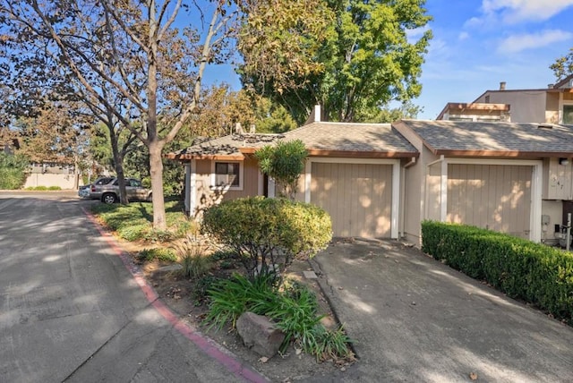 ranch-style house featuring a garage