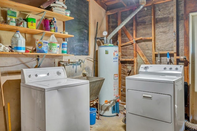 washroom featuring gas water heater and washing machine and dryer