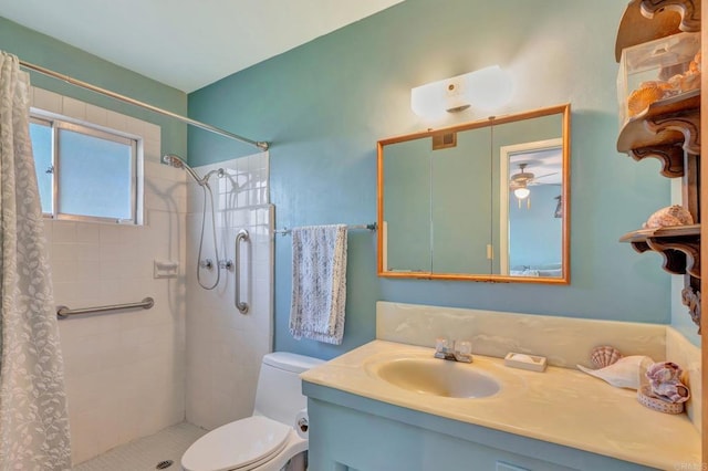 bathroom featuring vanity, toilet, and curtained shower