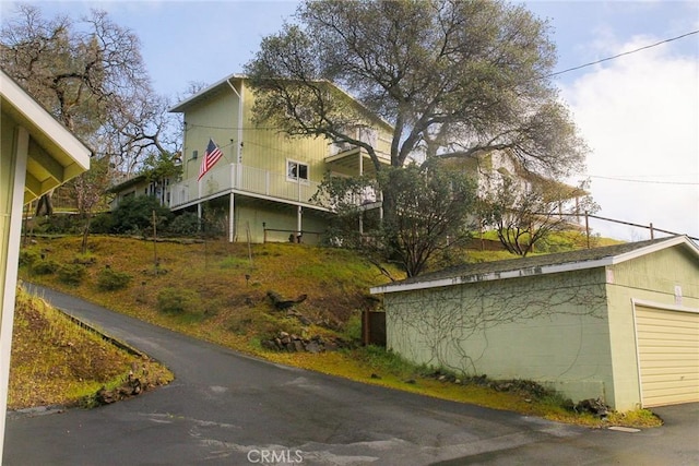 view of property exterior featuring a garage