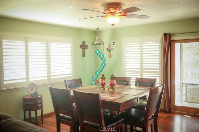 dining room with dark hardwood / wood-style floors, plenty of natural light, and ceiling fan