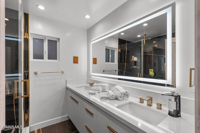 bathroom featuring vanity and a shower with shower door