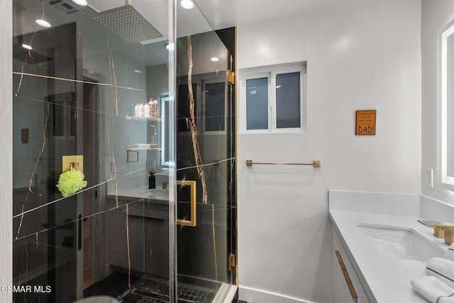 bathroom with vanity and walk in shower