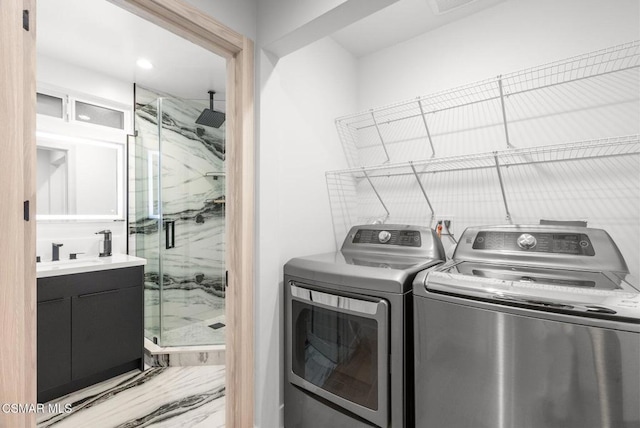 laundry room with sink and washing machine and dryer