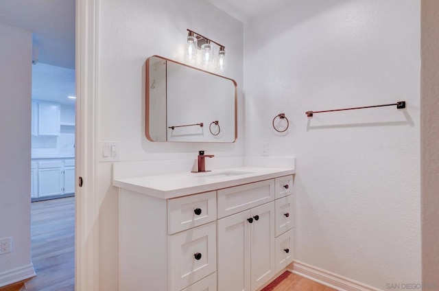 bathroom featuring vanity and hardwood / wood-style flooring