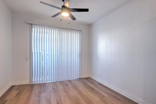 unfurnished room featuring ceiling fan and light hardwood / wood-style flooring